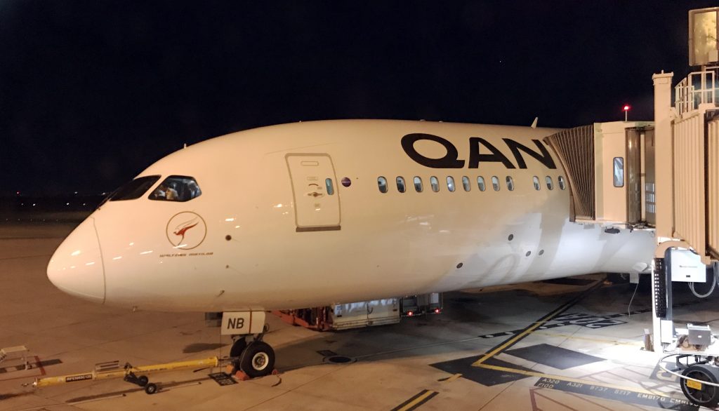 Qantas plane docked at terminal